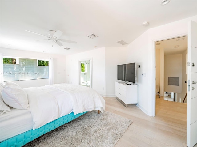 bedroom with ceiling fan and light hardwood / wood-style flooring