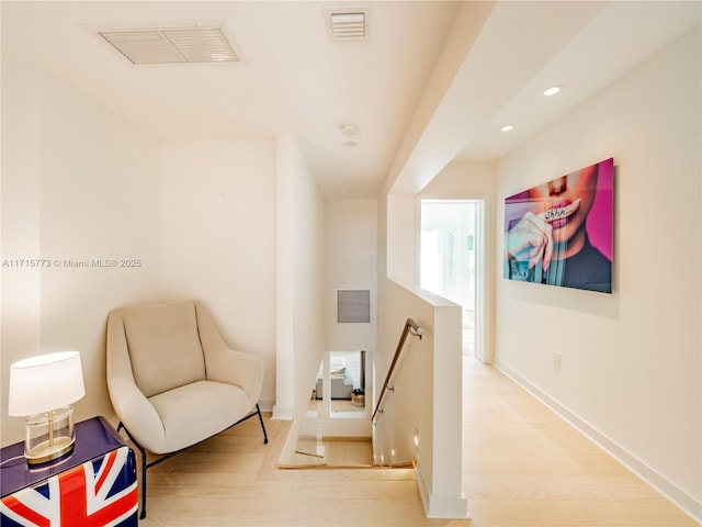 sitting room with hardwood / wood-style floors