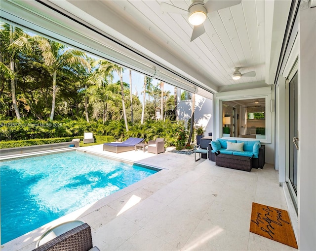 view of pool featuring a patio, ceiling fan, and outdoor lounge area