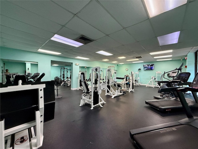 gym featuring a paneled ceiling