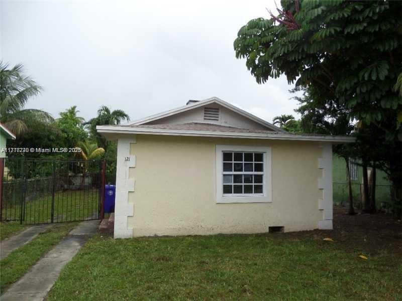 view of property exterior featuring a yard