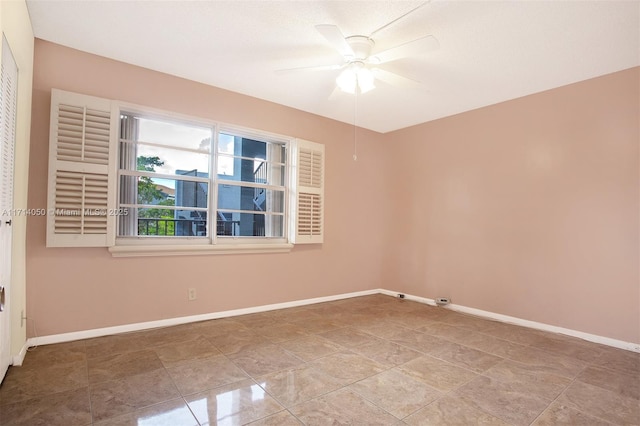 spare room with ceiling fan