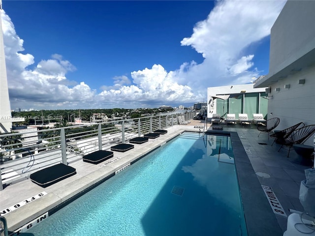 view of swimming pool featuring a patio area