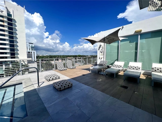 wooden deck with a patio