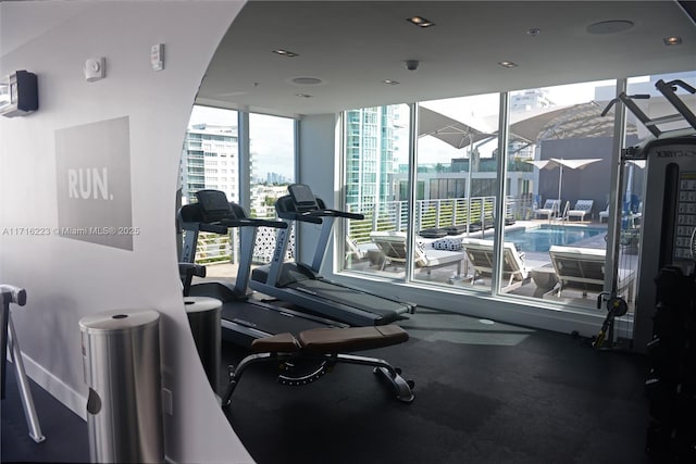 workout area featuring expansive windows