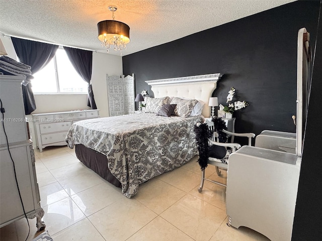 tiled bedroom featuring a textured ceiling and a notable chandelier