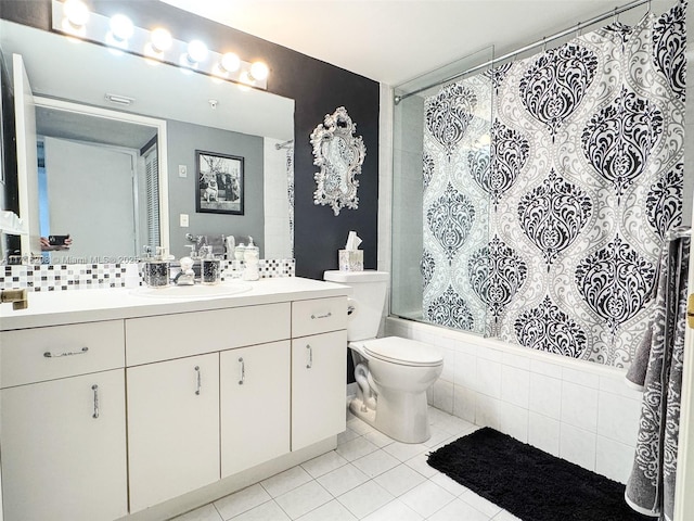 full bathroom featuring tile patterned flooring, toilet, decorative backsplash, vanity, and shower / tub combo