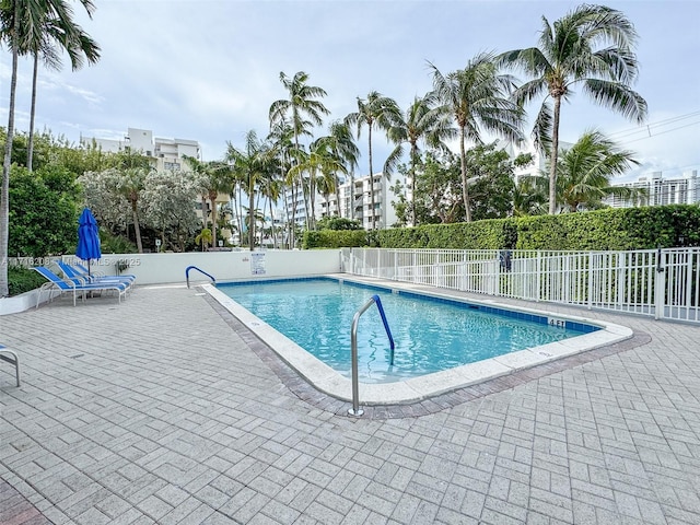 view of swimming pool featuring a patio area