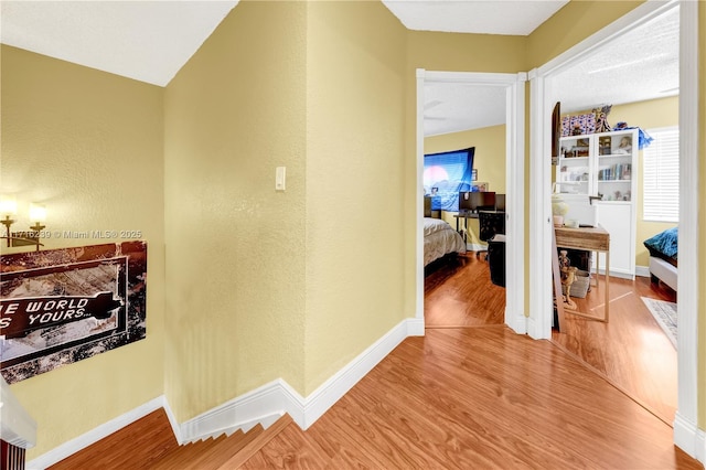 corridor featuring hardwood / wood-style flooring