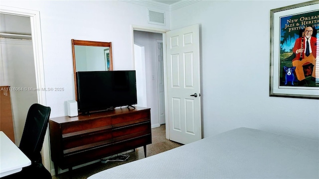 bedroom featuring a closet and ornamental molding