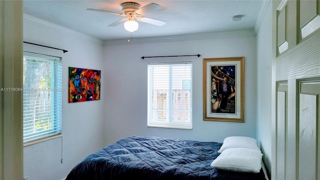 bedroom with ceiling fan and crown molding