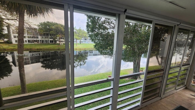 doorway to outside featuring a water view