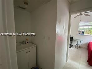 bathroom with sink, tile patterned floors, and ceiling fan