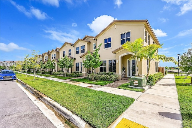 view of front of property with a front lawn