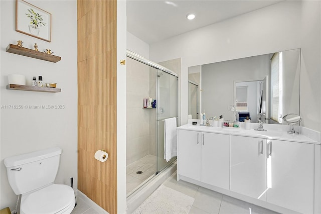 bathroom featuring tile patterned flooring, vanity, an enclosed shower, and toilet