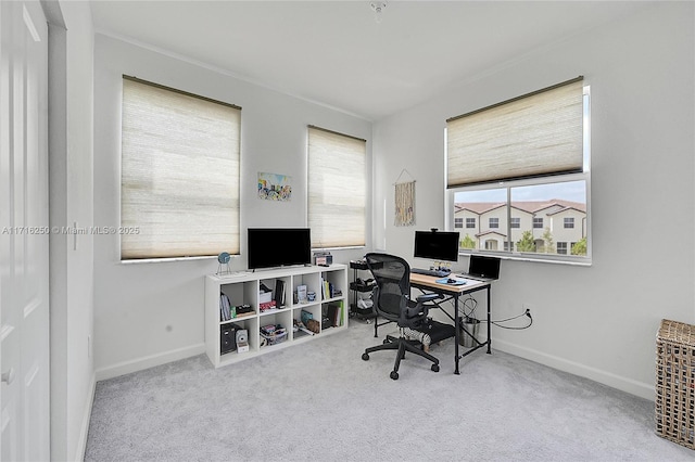 carpeted office space featuring a wealth of natural light