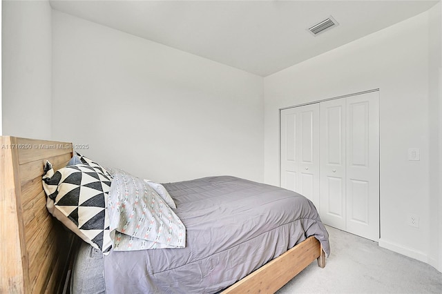 bedroom with a closet and carpet