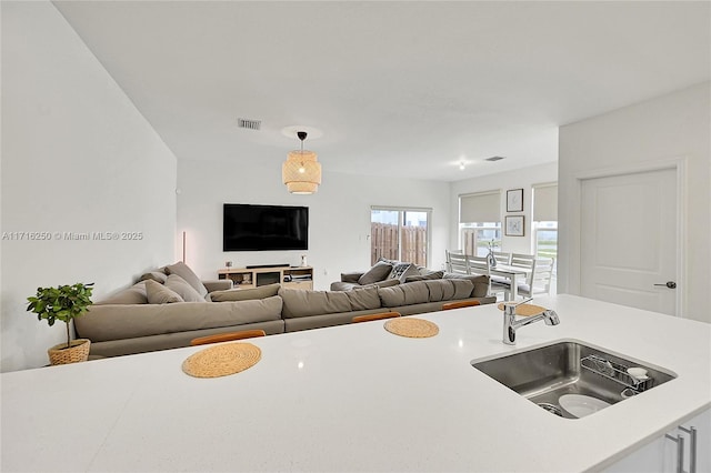 kitchen featuring hanging light fixtures and sink