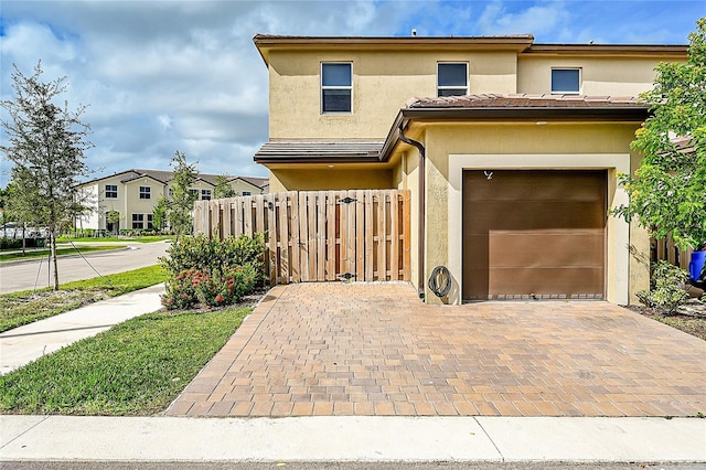 view of front of property featuring a garage