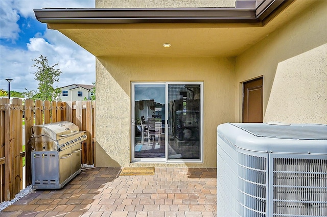 view of patio with central AC and grilling area