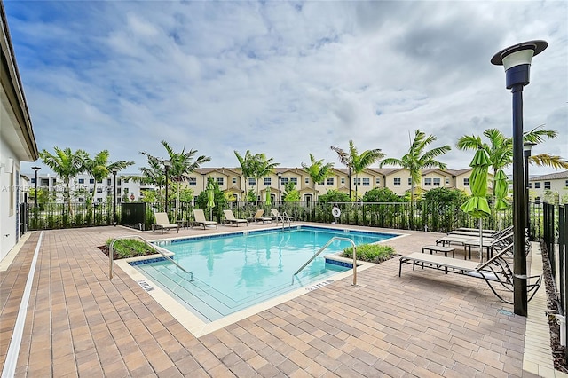 view of swimming pool with a patio area