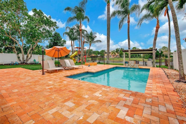 view of swimming pool featuring a patio area