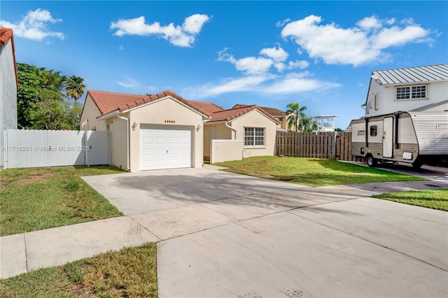 view of front facade featuring a front yard and a garage