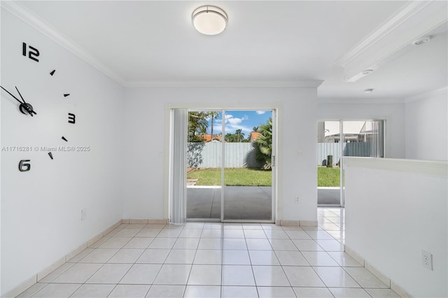 interior space with a wealth of natural light, ornamental molding, and light tile patterned flooring