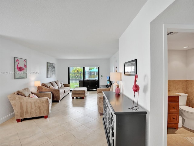 living room featuring light tile patterned floors