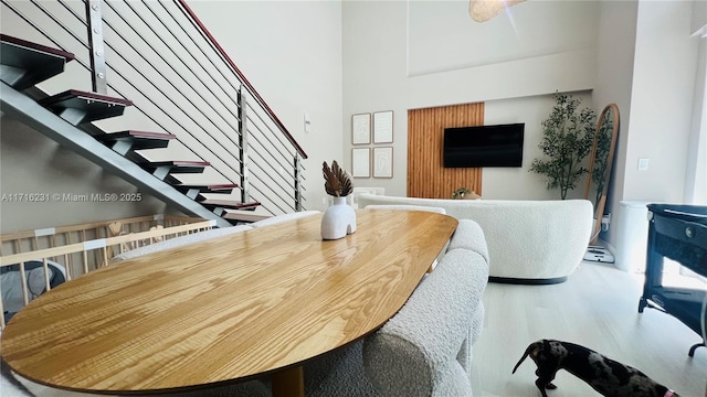 dining space with hardwood / wood-style floors