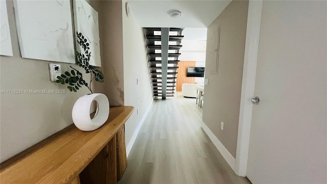 corridor featuring light hardwood / wood-style floors