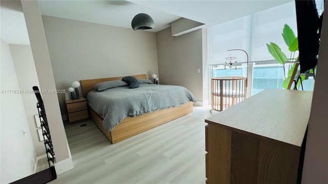 bedroom with light wood-type flooring