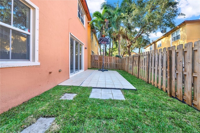 view of yard with a patio area and a fenced backyard