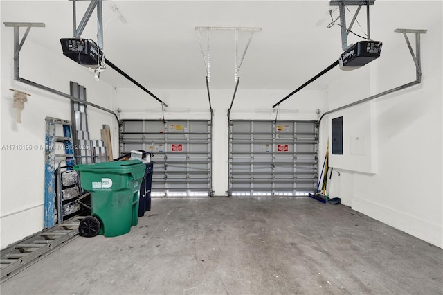 garage featuring a garage door opener and electric panel