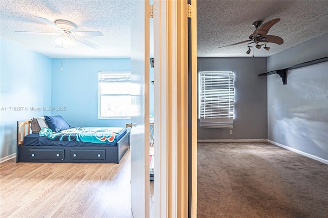 bedroom featuring a textured ceiling and ceiling fan