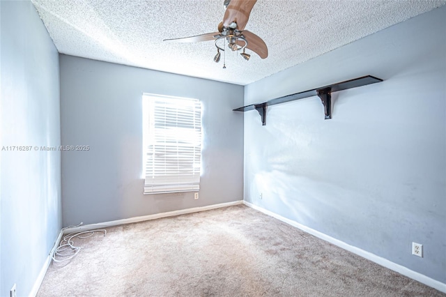 carpeted empty room with a textured ceiling and ceiling fan