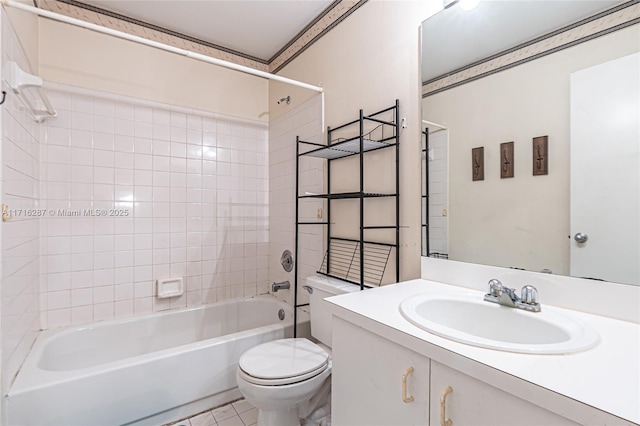 full bathroom with vanity, tiled shower / bath combo, toilet, and tile patterned flooring