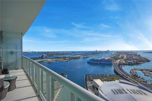 balcony featuring a water view