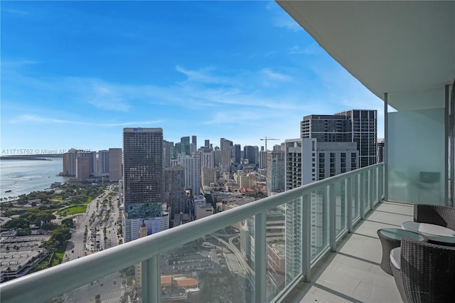 balcony featuring a water view