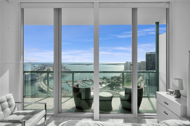 bedroom featuring a water view