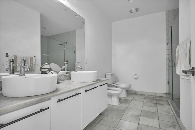 bathroom featuring toilet, a bidet, vanity, and walk in shower