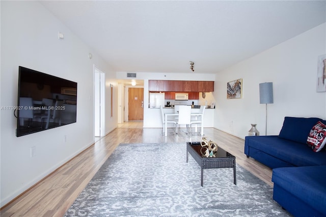 living room featuring light hardwood / wood-style floors