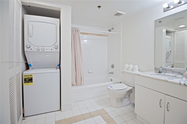 full bathroom featuring vanity, tile patterned floors, toilet, shower / bathtub combination with curtain, and stacked washing maching and dryer