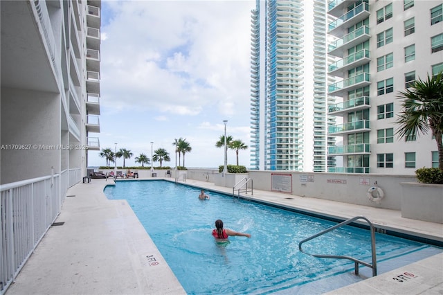 view of swimming pool with a patio area