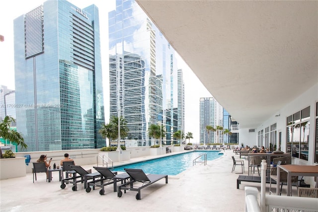 view of swimming pool with a patio