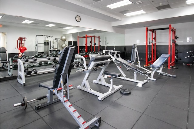 gym featuring a drop ceiling