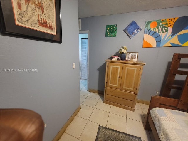 hallway featuring light tile patterned flooring