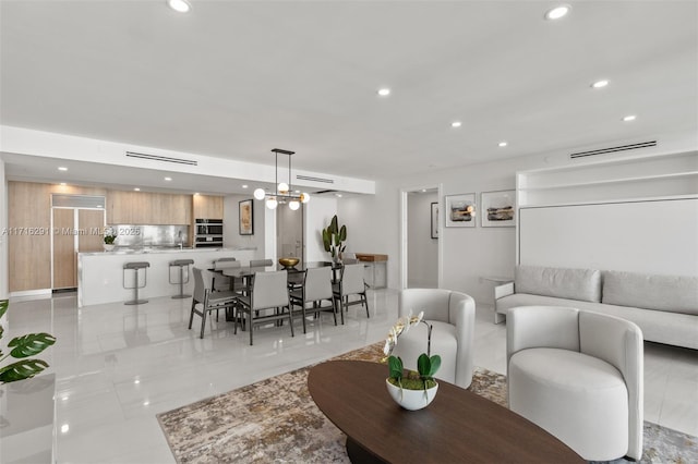 living room featuring a chandelier