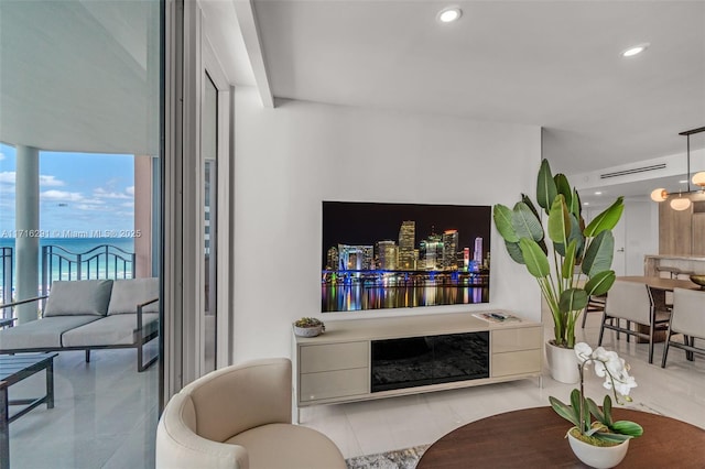 living room featuring light tile patterned flooring and recessed lighting