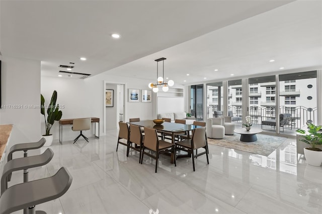 dining space featuring a wall of windows and an inviting chandelier